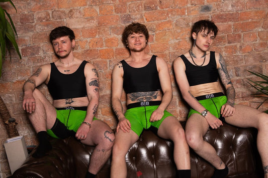 three models in chest binders